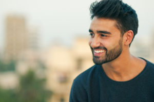 Side view portrait of a beautifull smiling man indian ethnicity